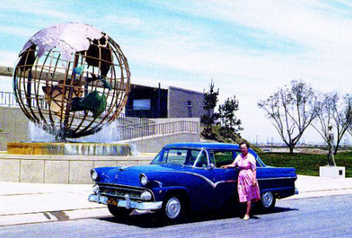 Doris Sevilla with her 1956 ford in front of the mini-globe.